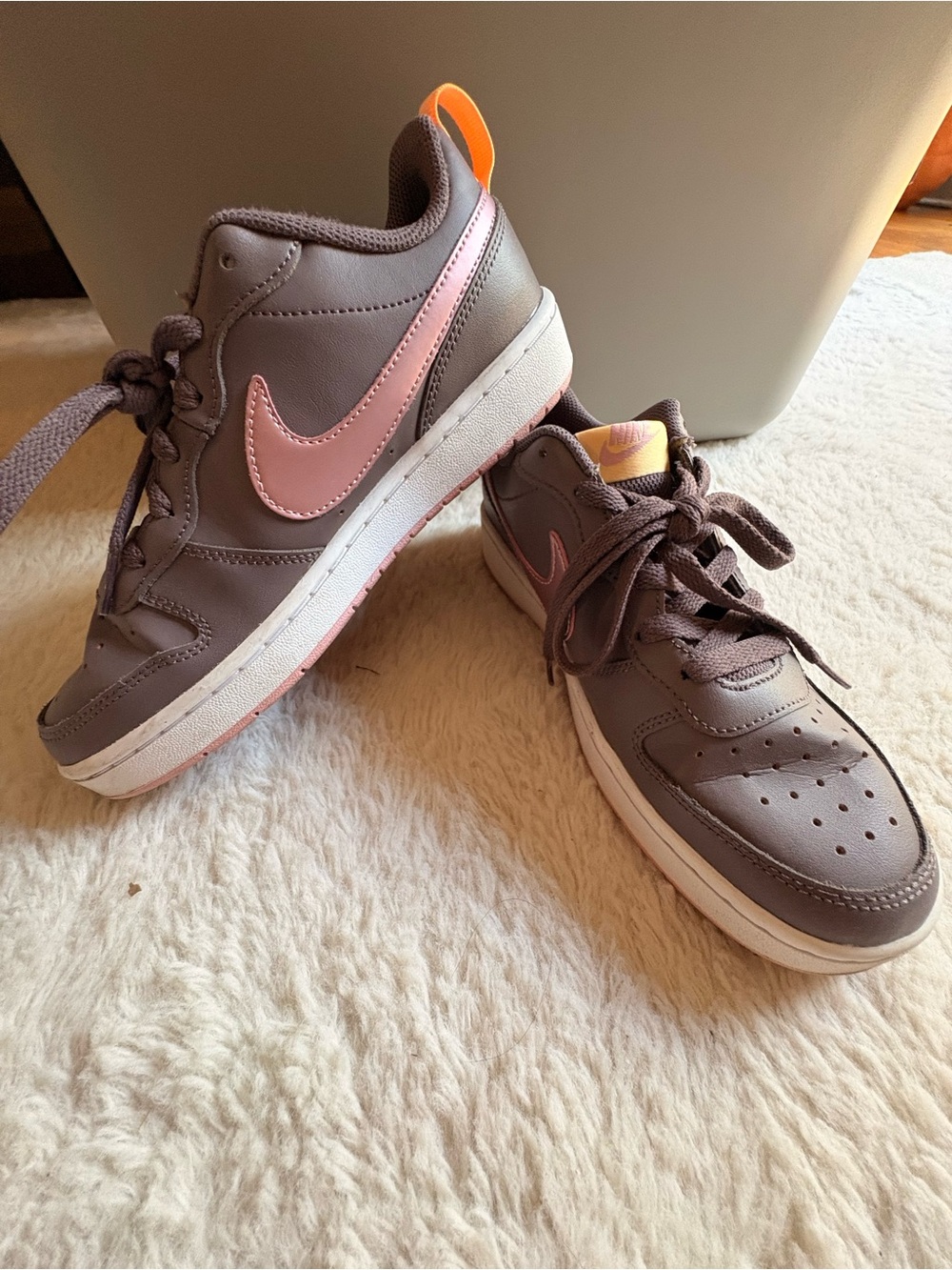Nike Brown Sneakers with Pink Swoosh.